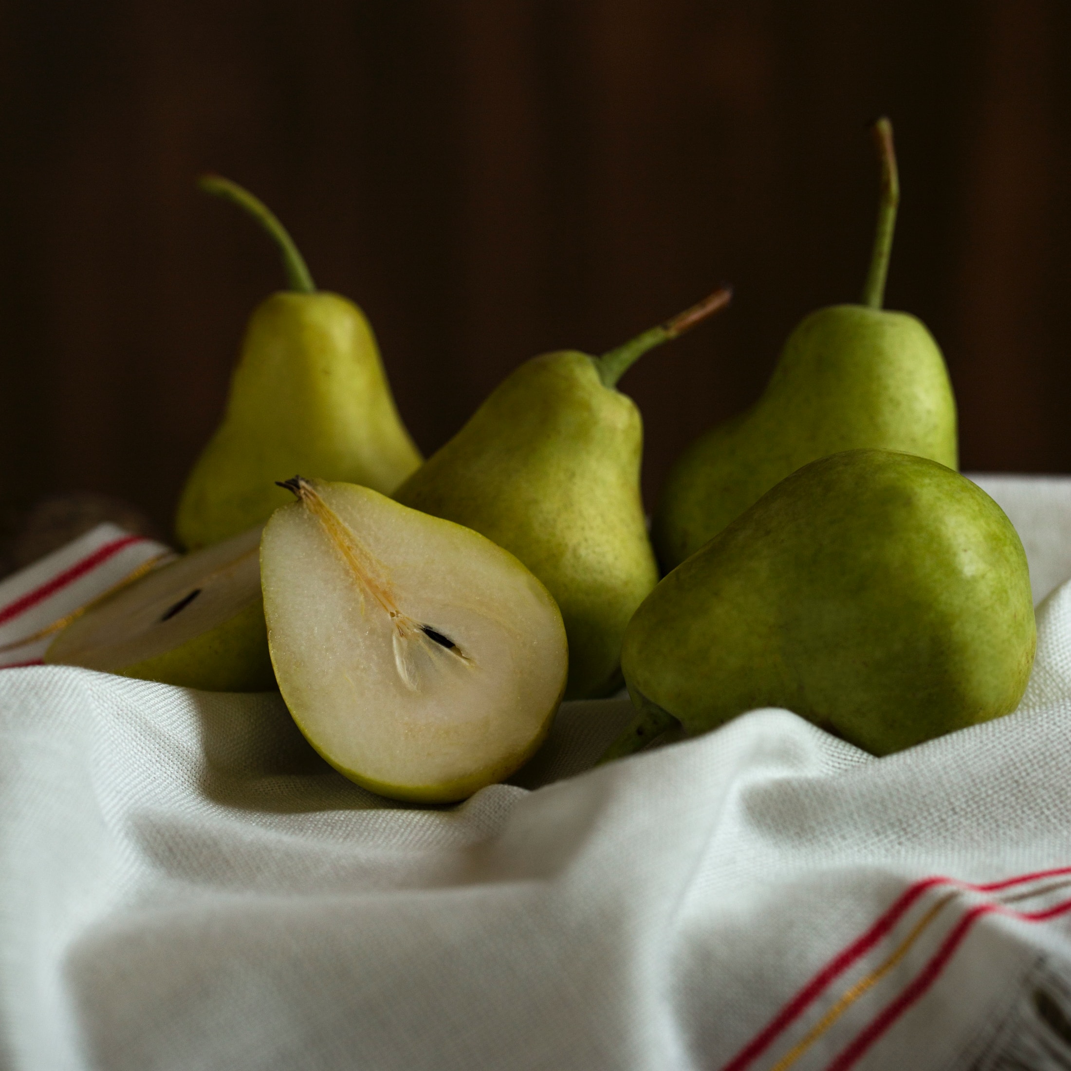 green apple fruit on white textile